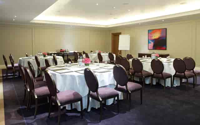 The Nelson Room in Corinthia London: elegant meeting space with natural light for events.