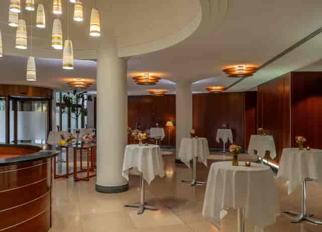 The Charles Hotel Ballroom in Munich, elegant event space with cocktail tables for gatherings.