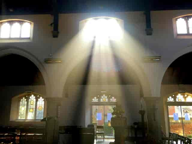 St Mary Magdalene Church with dramatic backlight for milestone ceremonies and events.