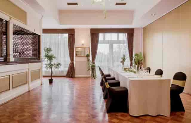 Boardroom meeting setup at Clumber Park Hotel with wood floors for corporate events and conferences.