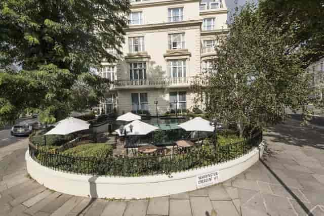 Charming outdoor event venue at Jananeh Restaurant with seating and umbrellas.