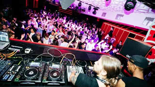 Arena Classic DJ performance with immersive lighting for corporate party events.