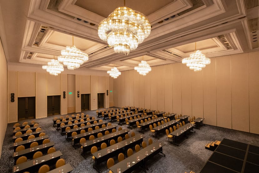 Regency Ballroom B classroom setup with chandeliers for corporate training or conferences.