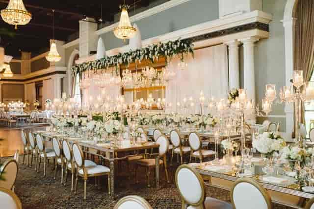 Luxury Artifacts Room banquet setup with gold chairs for upscale weddings and galas.