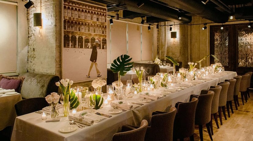 GEORGE Restaurant dining room with long-table setup for corporate dinners and private events.