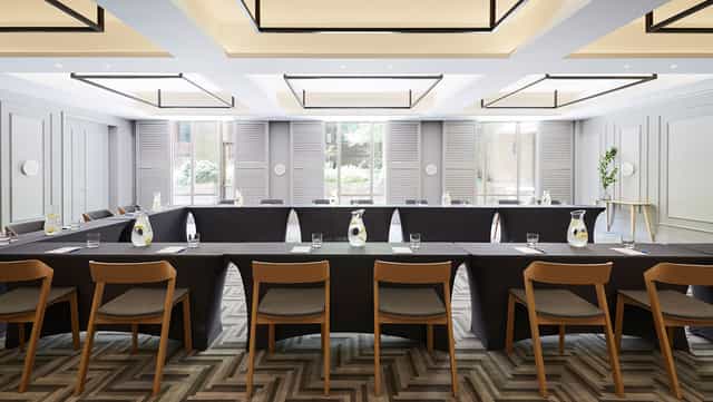 Peregrine Room boardroom with U-shape seating, ideal for professional meetings and events.
