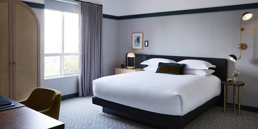 Modern Peregrine Room at Kimpton Saint George with workspace for business travel and site inspection.
