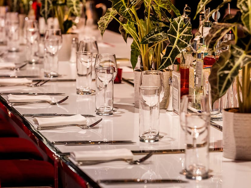 VIP Sapphire Lounge banquet setup: luxury long-table dinner for corporate events or galas.