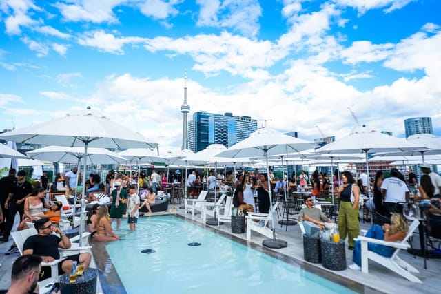 Rooftop patio event venue in Toronto with pool-side lounge seating for corporate networking.