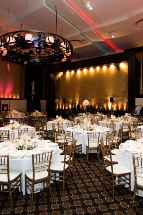 Eglinton Grand ballroom with gold chairs, perfect for formal wedding gala event decor.
