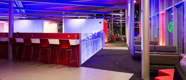 Modern Private Library Bar with LED lighting for networking and cocktail events.