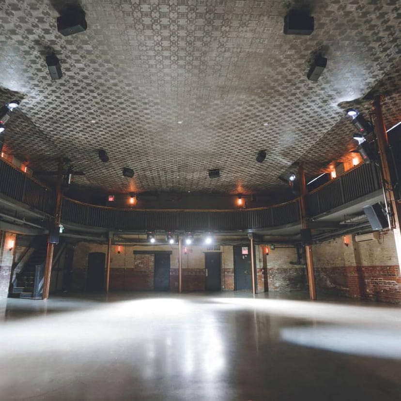 Industrial-chic Main Hall venue with exposed brick, ideal for experiential events and conferences.