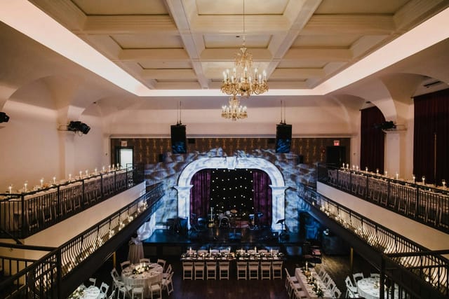 Main Hall ballroom with tiered seating, ideal for elegant galas and wedding reception venues.