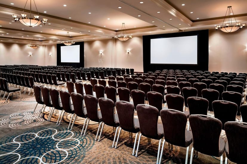 Sheraton Toronto Airport hotel ballroom with classroom seating for corporate events and conferences.