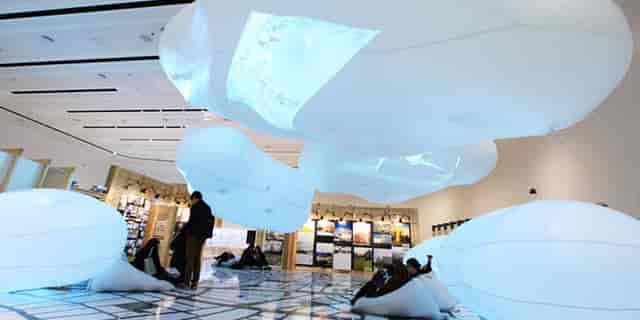 Immersive inflatable lounge at Global Exhibition for corporate networking event.