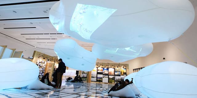 Immersive inflatable lounge at Global Exhibition for corporate networking event.