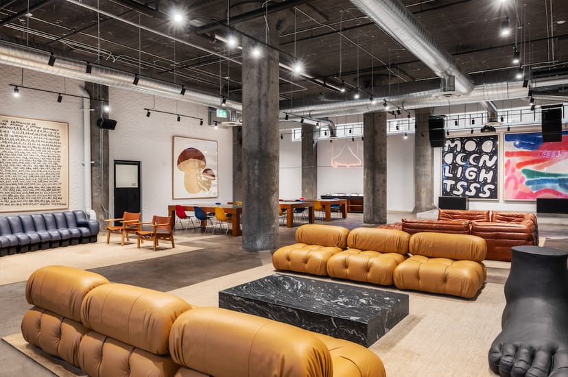 Industrial-chic breakout space with modular seating for networking and creative events.