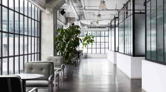 Industrial-chic breakout space with lounge seating for networking and off-site brainstorming.