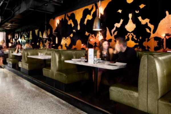 Moody semi-private dining room at The Drake Hotel for VIP networking and executive dinners.