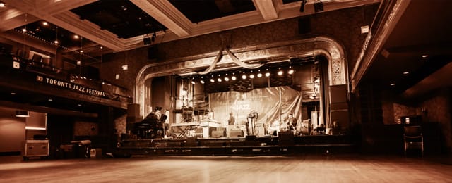 Jazz Festival stage in 888 Yonge heritage ballroom with vintage architecture for event venues.