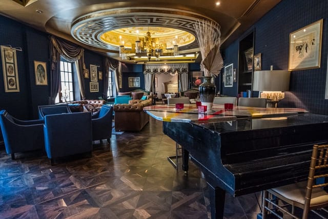 Gatsby Restaurant VIP lounge with grand piano for exclusive networking and sophisticated events.