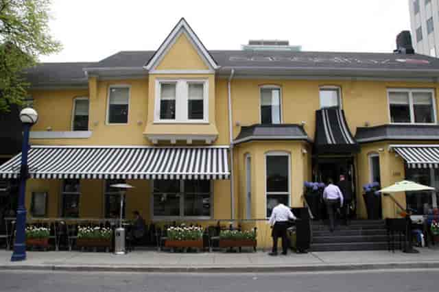 Sassafraz restaurant with yellow facade for corporate receptions and private dining events.
