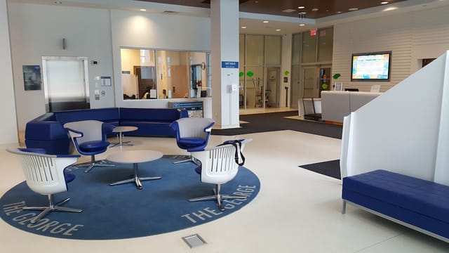 Modern breakout room with modular seating for professional networking and event registration.