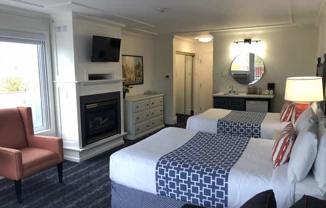 Double queen room in Huronia Room at Fern Resort for group accommodations and VIP event hosting.