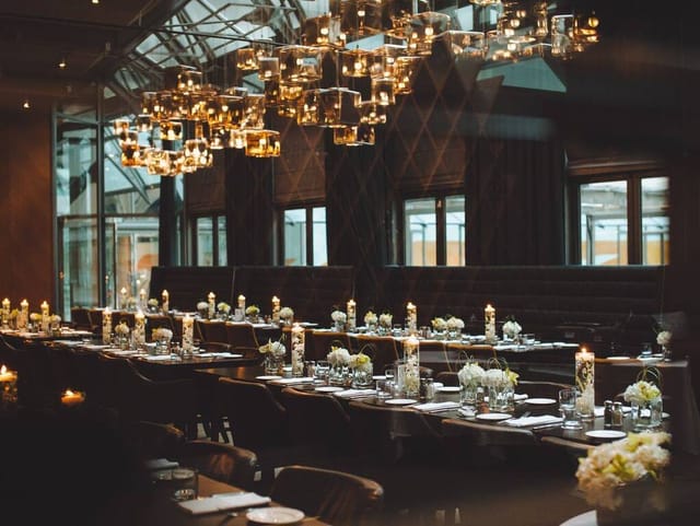 Foxwarren Room banquet setup with statement lighting for corporate dinners and luxury weddings.