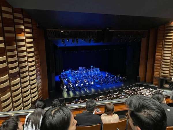 Meridian Hall stage with blue lighting for corporate galas and keynote presentations.