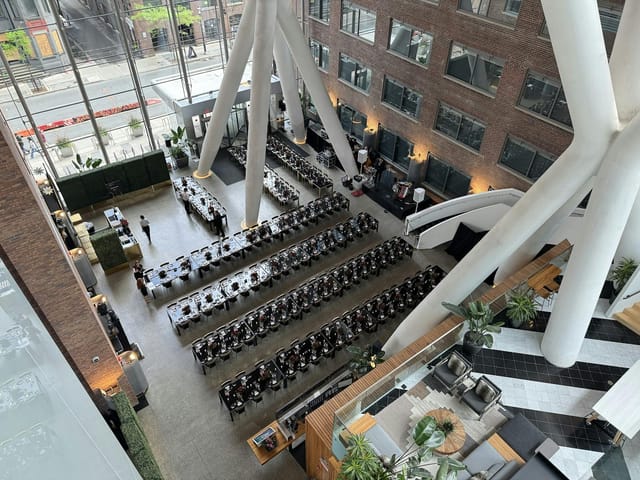 Industrial banquet venue at Ricarda's with long tables for corporate events and weddings.