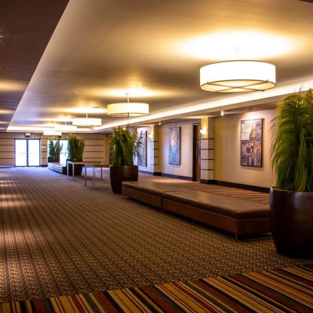 Modern Toronto Congress Centre ballroom pre-function area for event registration and coffee breaks.