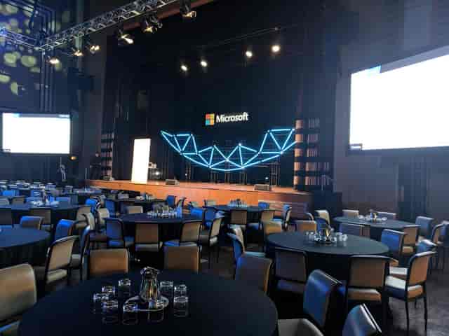 Corporate stage at The Carlu Round Room with geometric LED backdrop for professional events.