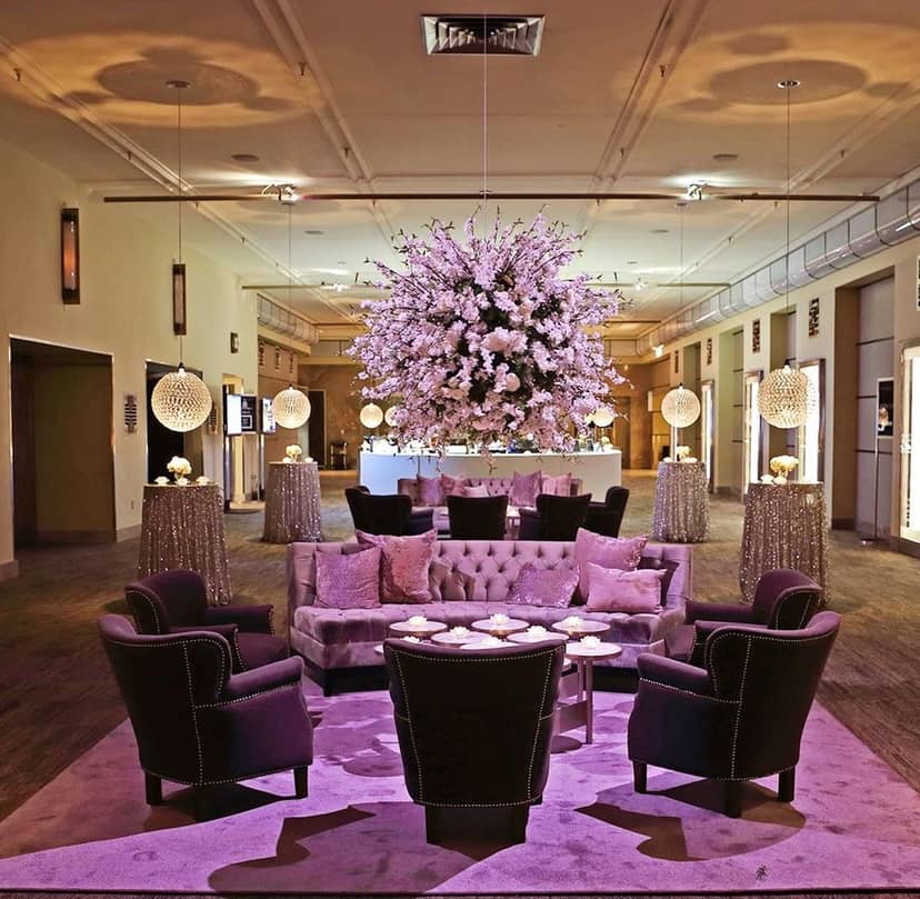 The Carlu Clipper Room lounge setup with floral centerpiece for corporate event networking.