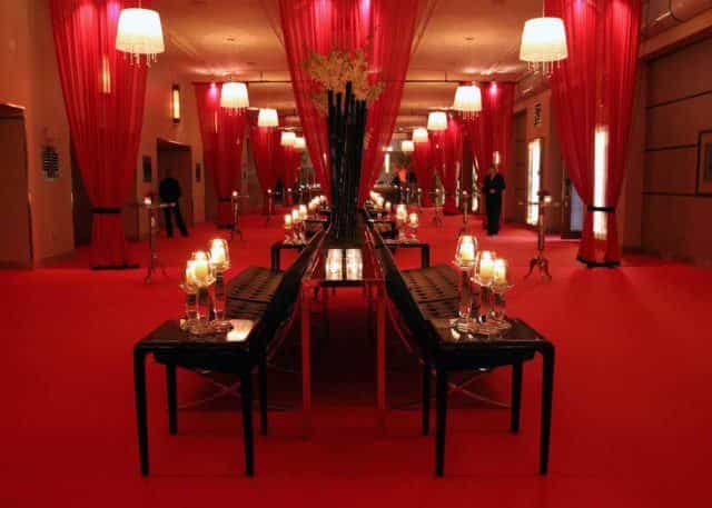 Clipper Room at The Carlu featuring red lounge decor for a sophisticated VIP cocktail reception.