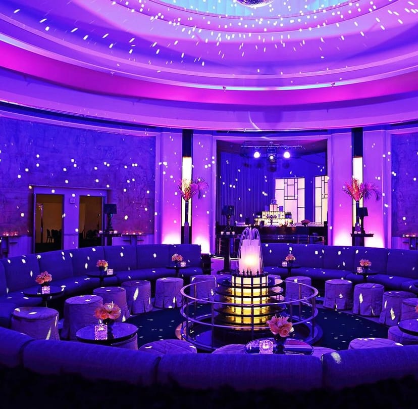 Carlu Ballroom lounge with purple LED lighting for upscale networking and exclusive after-party.