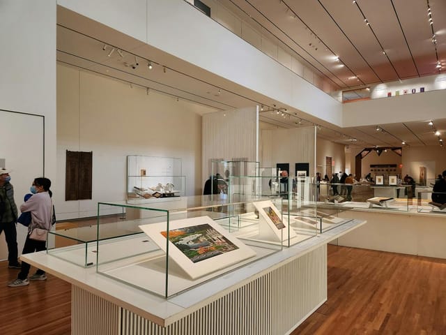 Aga Khan Museum gallery with glass vitrines for corporate receptions and networking events.