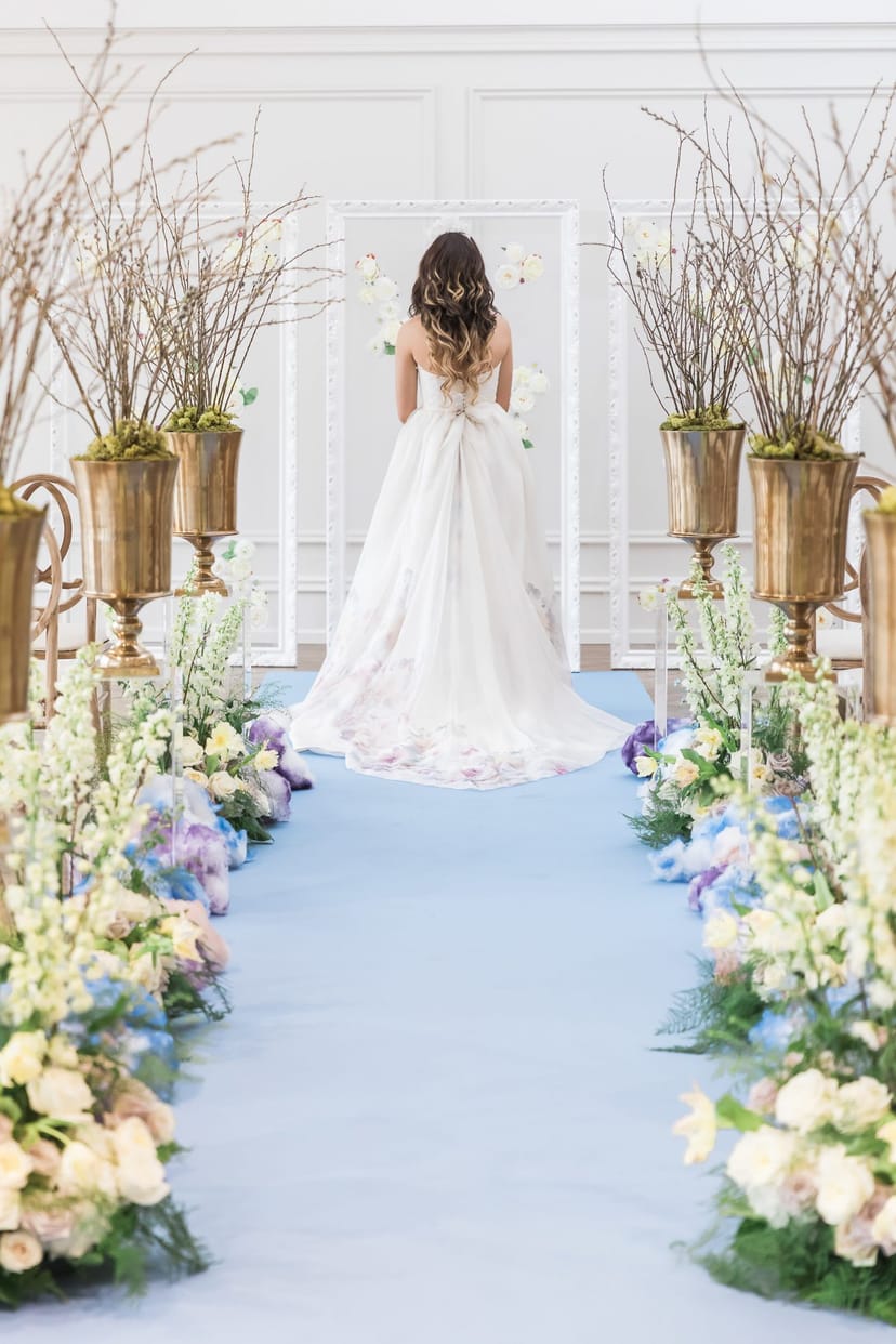 Heritage House ceremony aisle with custom runner and gold floral decor for luxury wedding events.