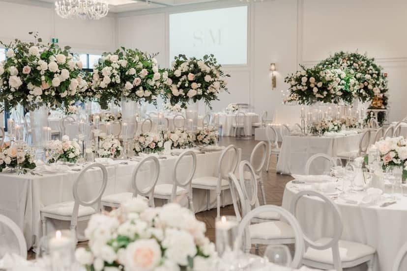 Monochrome ballroom at The Arlington Estate featuring grand florals for luxury gala or wedding.