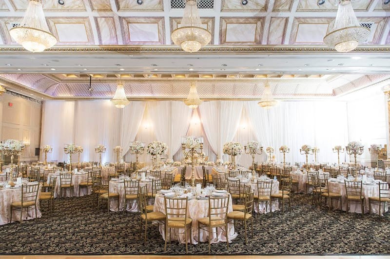 Chateau Le Jardin ballroom with crystal chandeliers for luxury wedding reception and gala event.
