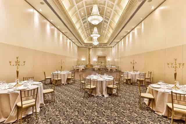 Chateau Le Jardin ballroom with crystal chandeliers for elegant weddings and formal gala dinners.