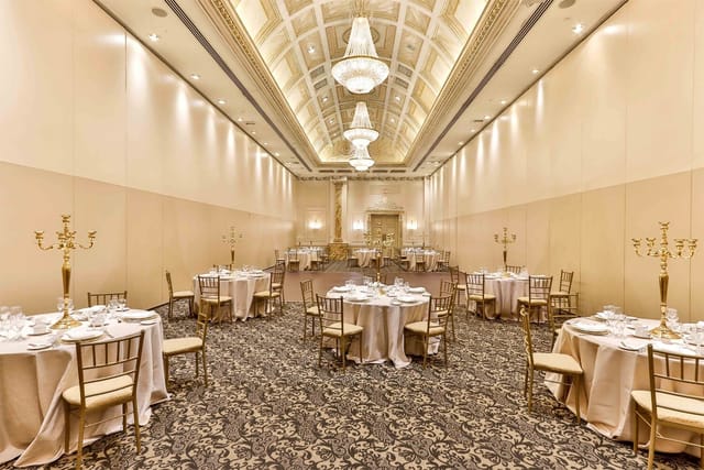 Chateau Le Jardin ballroom with crystal chandeliers for elegant weddings and formal gala dinners.