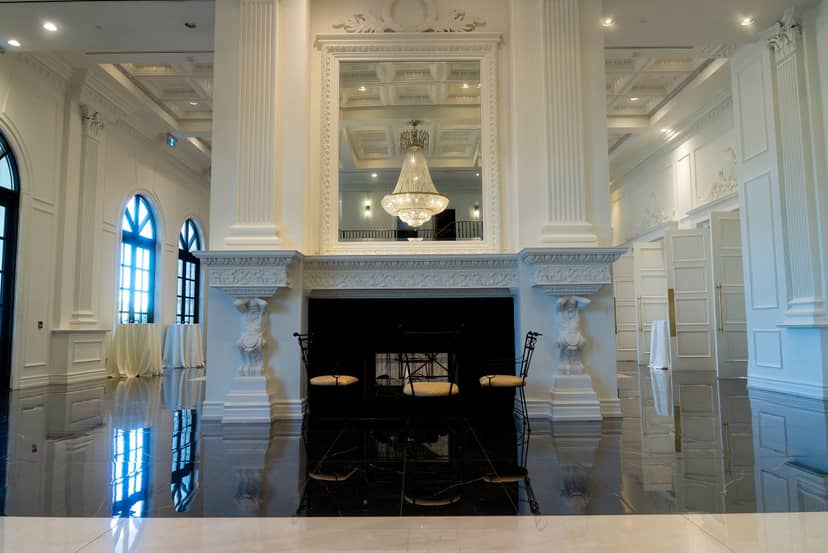 Neoclassic Chateau Le Jardin foyer with grand fireplace for upscale bridal portraits and events.