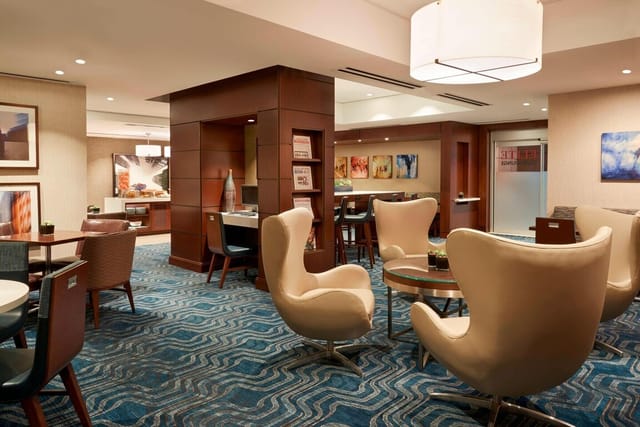 Modern hotel ballroom with flexible breakout space for corporate events and professional meetings.