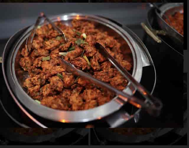 Chafing dish with fried appetizers at Palacio Event Centre for catering and networking events.