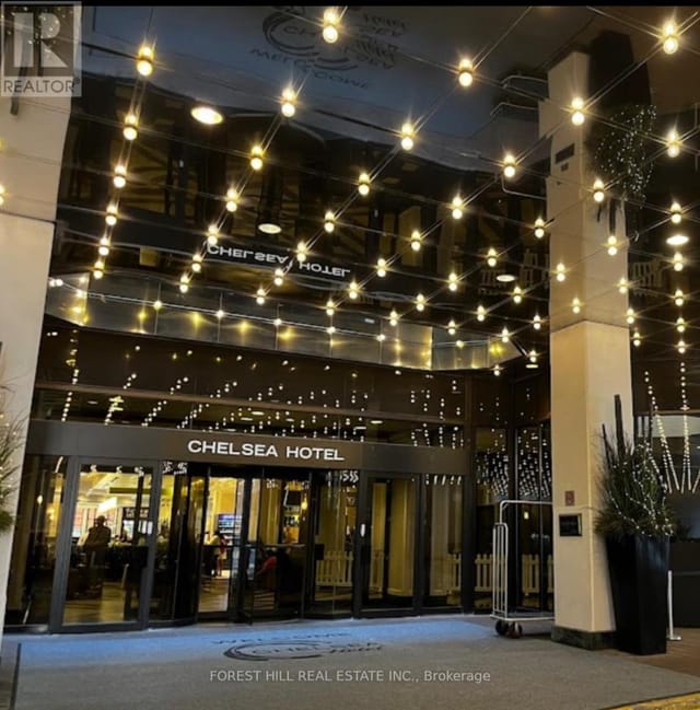 Monarch's at Chelsea Hotel Toronto exterior with festive lights for corporate events and galas.