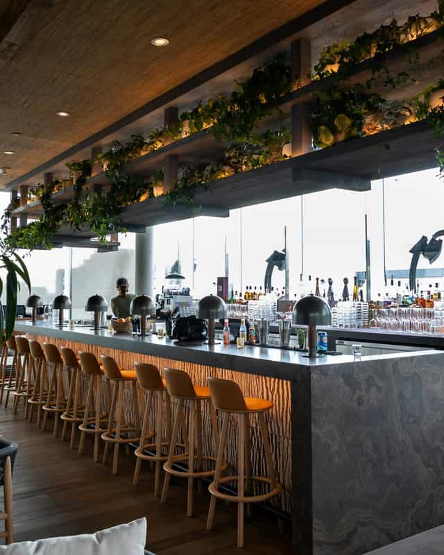 1 Hotel Toronto rooftop terrace: luxury venue with focal bar for corporate events and mixers.