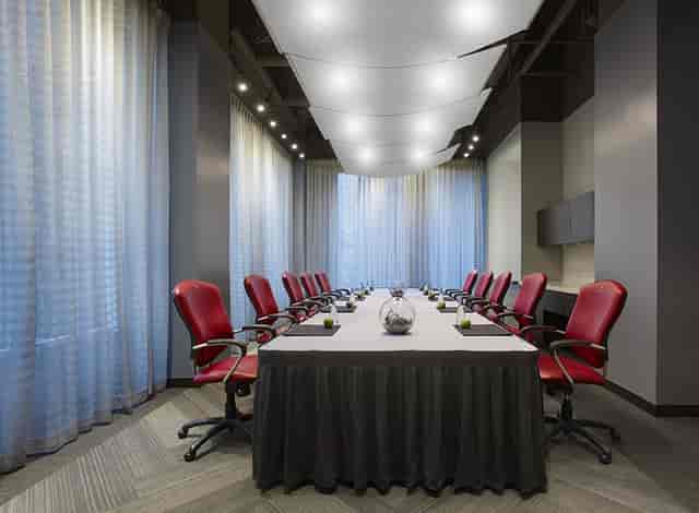 Pantages Hotel boardroom with red seating for executive meetings and corporate events.