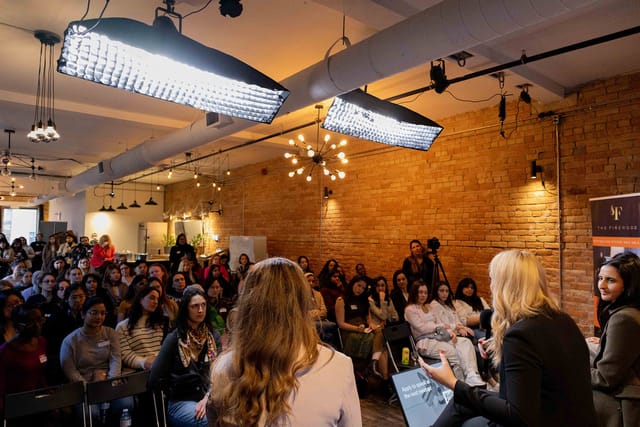 Fireside chat panel in industrial studio with professional lighting for corporate events.