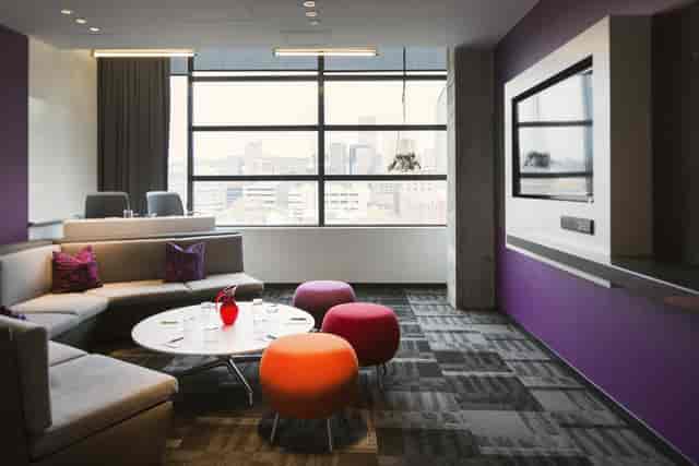 Rose-Fuchsia lounge at Alt Hotel Toronto: modern breakout space for informal corporate meetings.